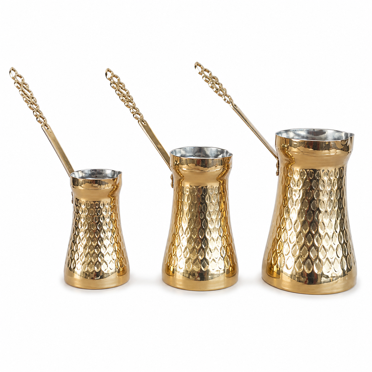 Three-piece coffee pot set in a gold finish with steel-toned interiors, graduated sizes