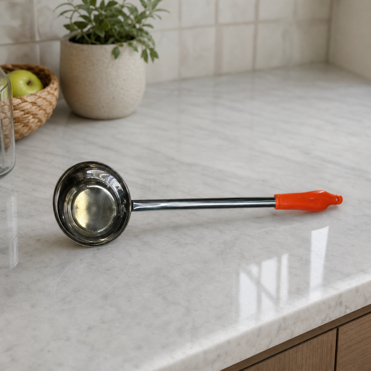 Stainless steel ladle with orange handle, 16 cm