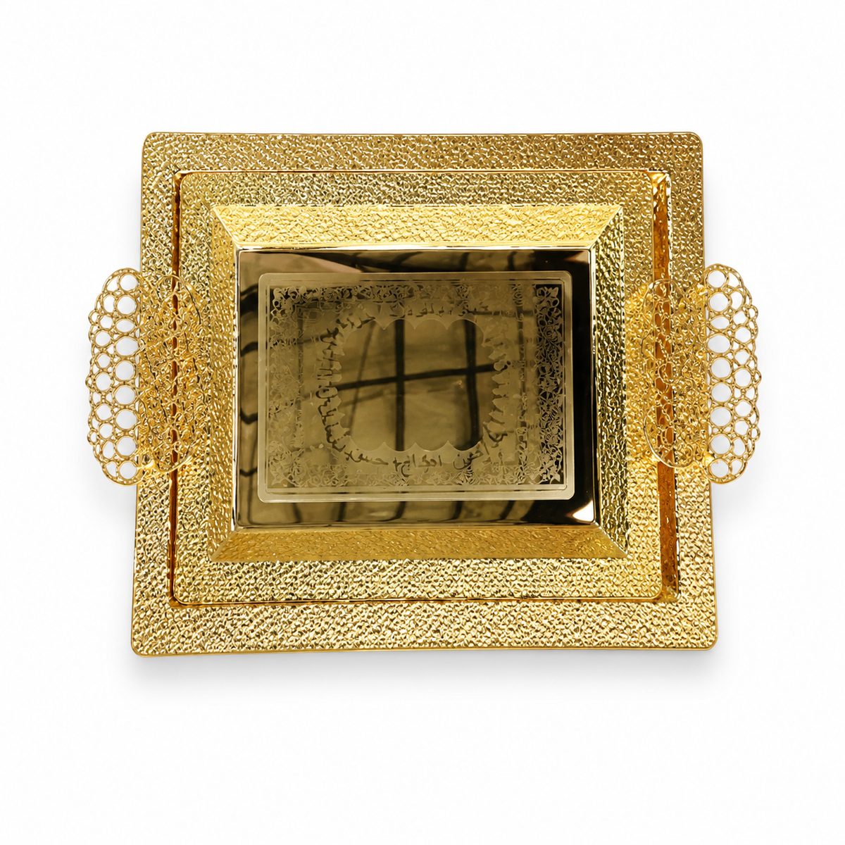 Two nested gold-tone serving trays with pebbled rims, openwork filigree handles and an engraved centre panel