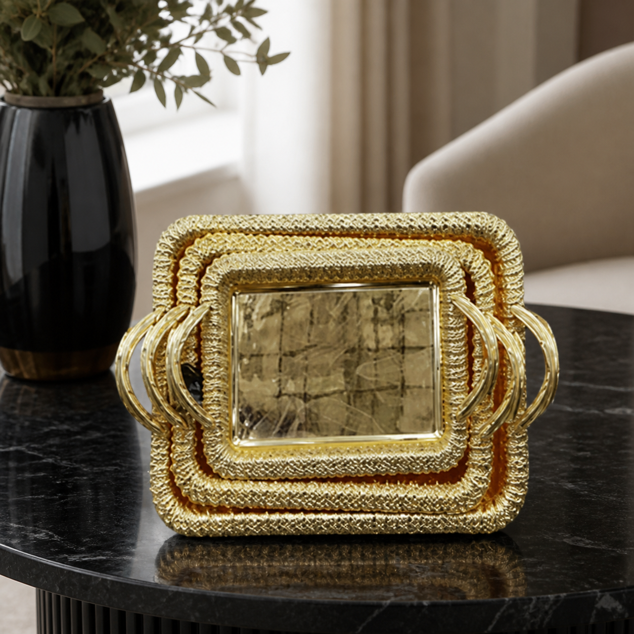 Gold-tone stainless steel serving tray set, three pieces