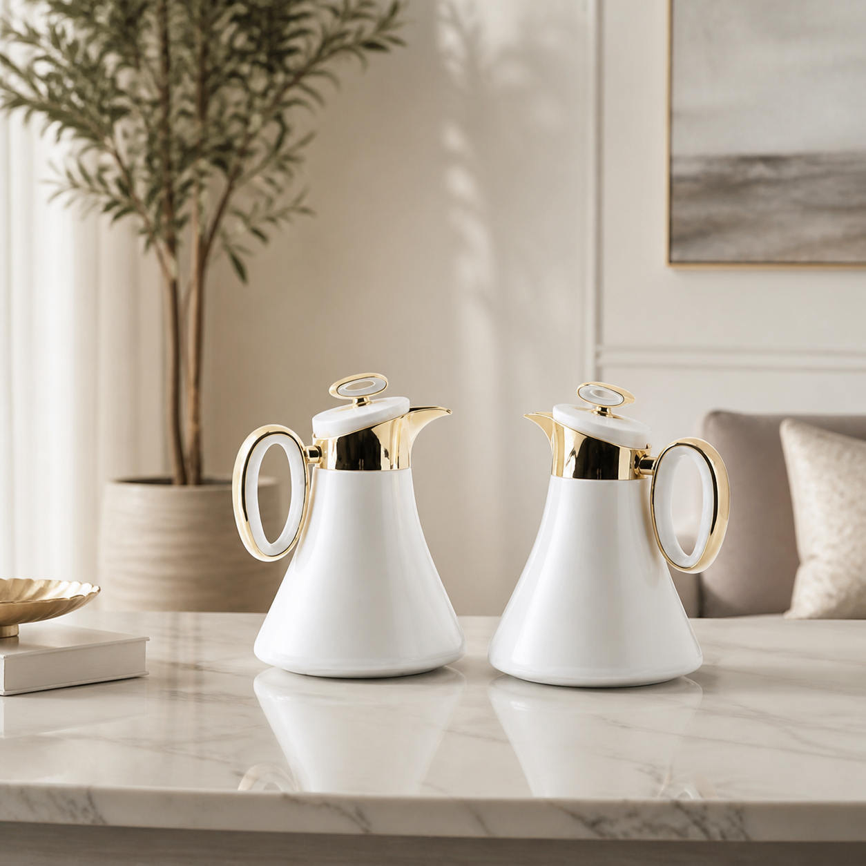 White and gold dallah coffee flask pair on a marble table in a bright living room