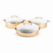Three-piece gold-tone food warmer set with white domed lids, shown on a white background