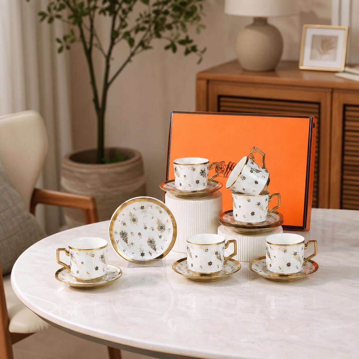 Porcelain coffee cup and saucer set, white with gold rim and floral pattern