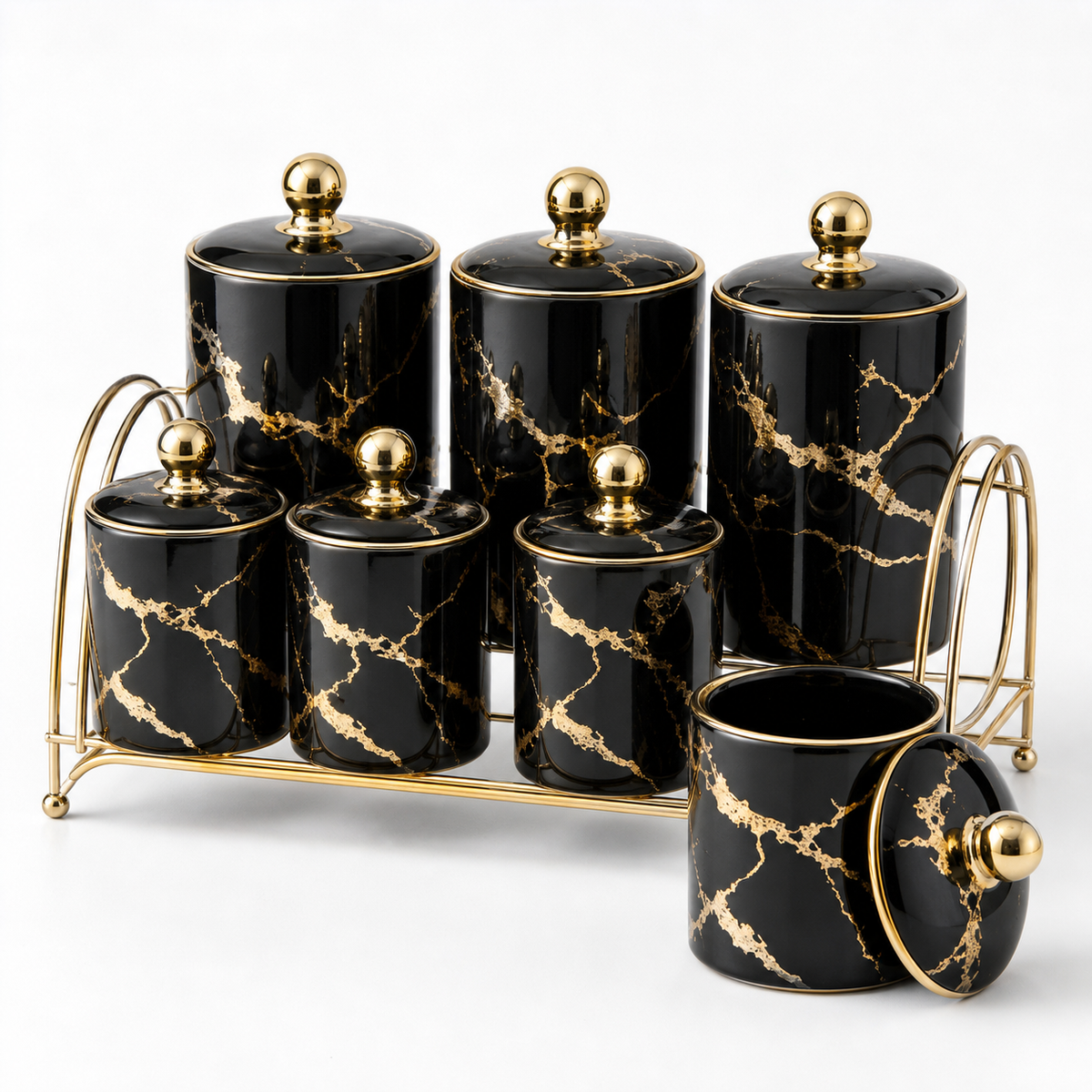 Black and gold ceramic spice and seasoning jar set on a gold-tone rack