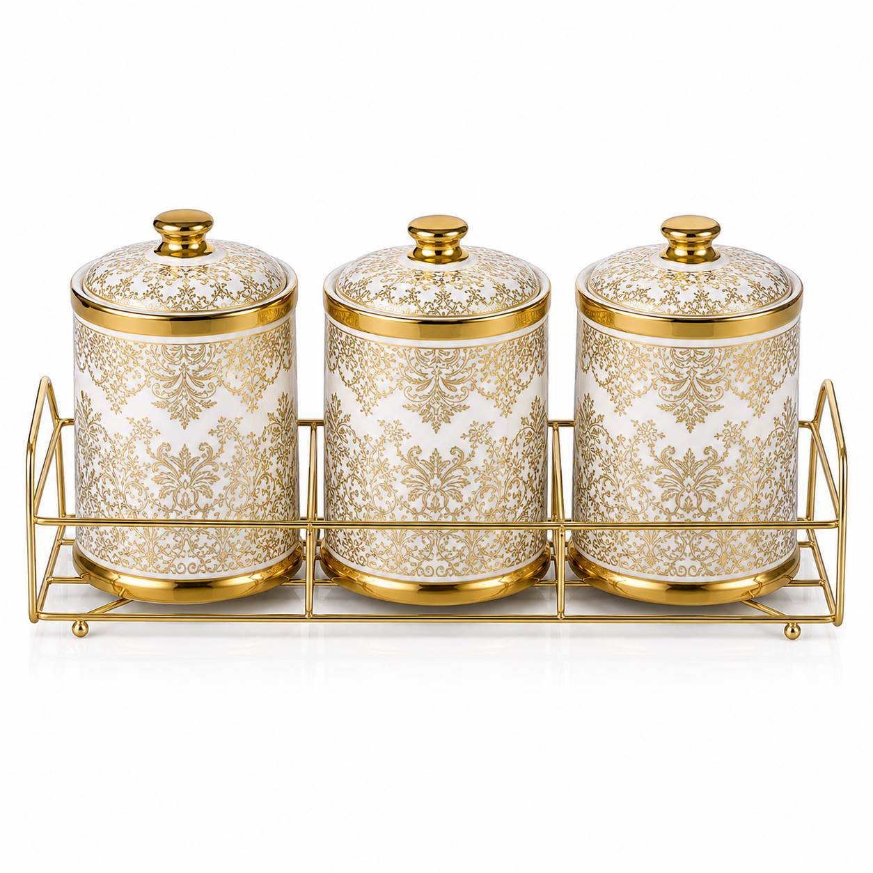 Three white ceramic canisters with all-over gold damask print and domed gold-rimmed lids on a gold rack