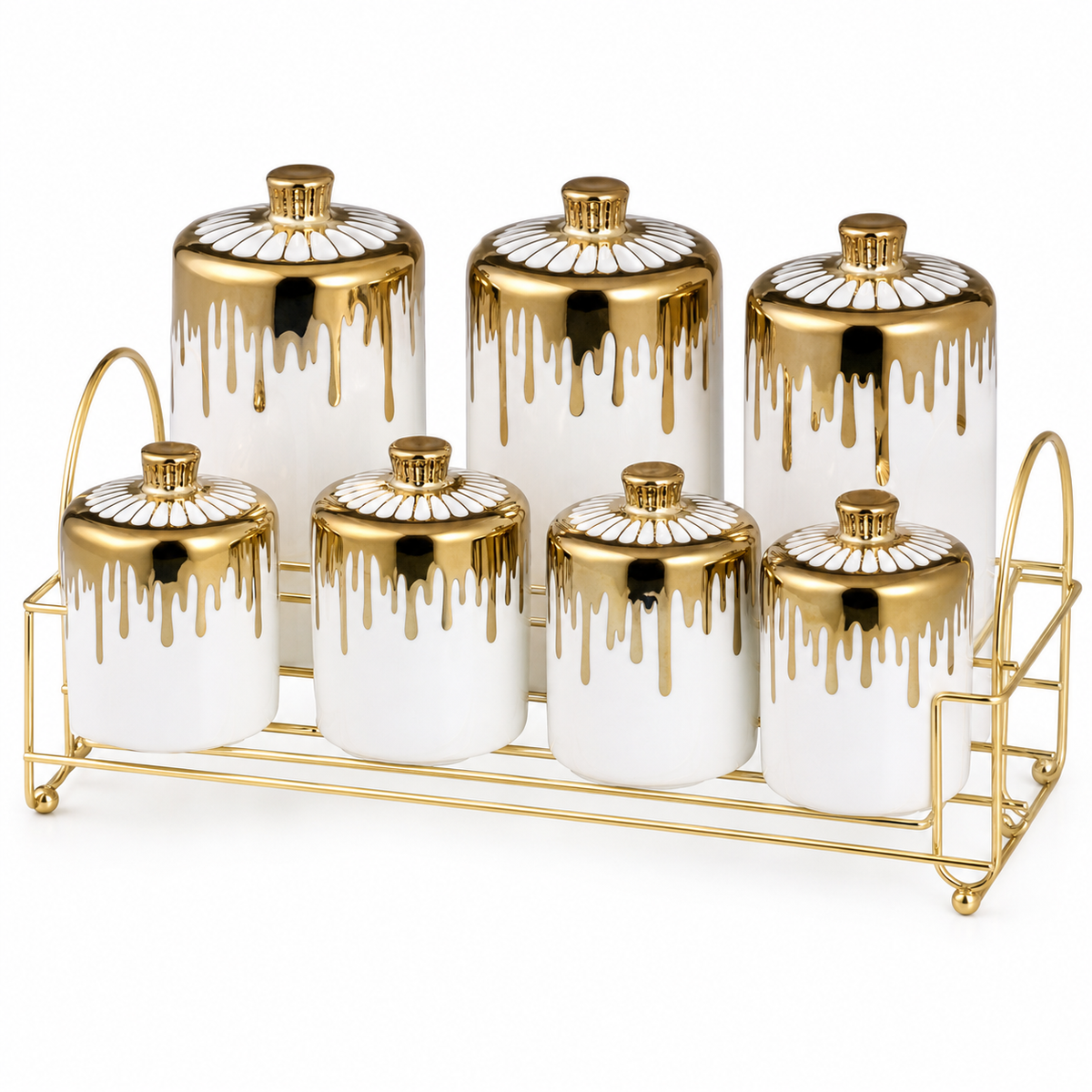 Seven white ceramic spice jars with gold drip-glaze lids on a gold-tone rack