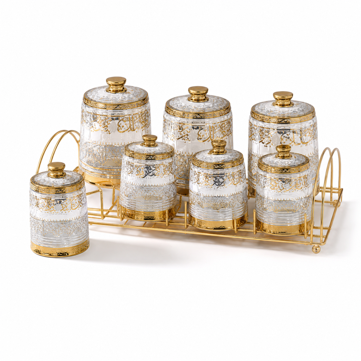Seven clear spice jars with gold patterning and gold knob lids on a gold-tone rack