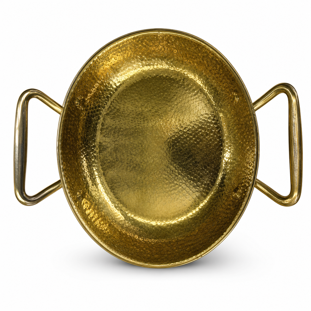 Shallow hammered gold-tone serving pan with two open loop handles, seen from above on white