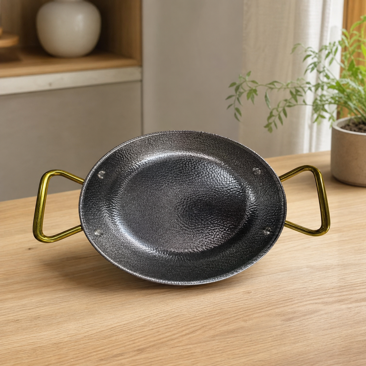 Silver stainless steel pot with gold-tone handles