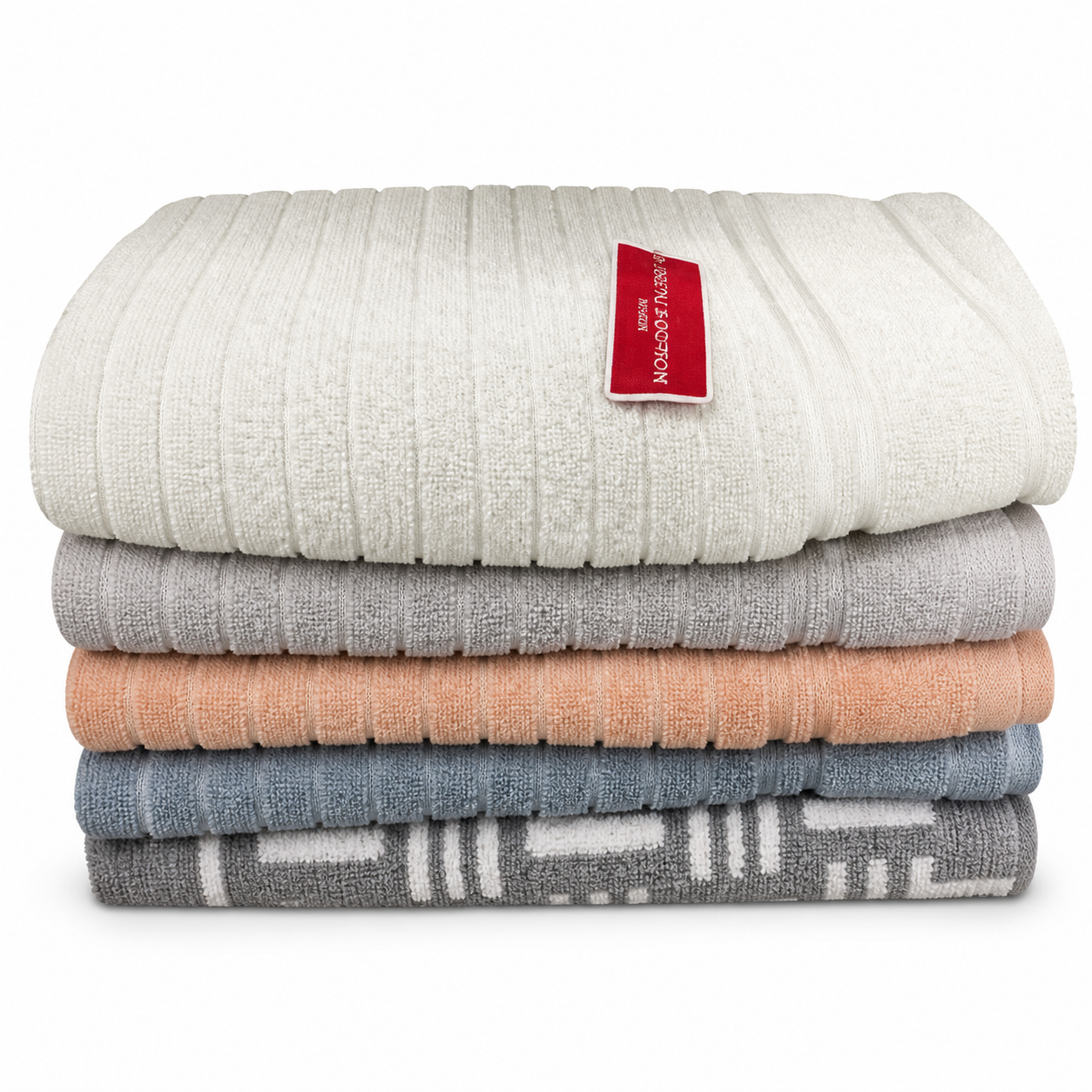 Stack of ribbed terry towels in cream, grey, peach and slate blue over a patterned grey towel
