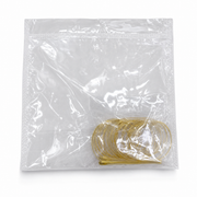 Coil of slim gold-tone hoops sealed in a clear zip-top bag on a white background