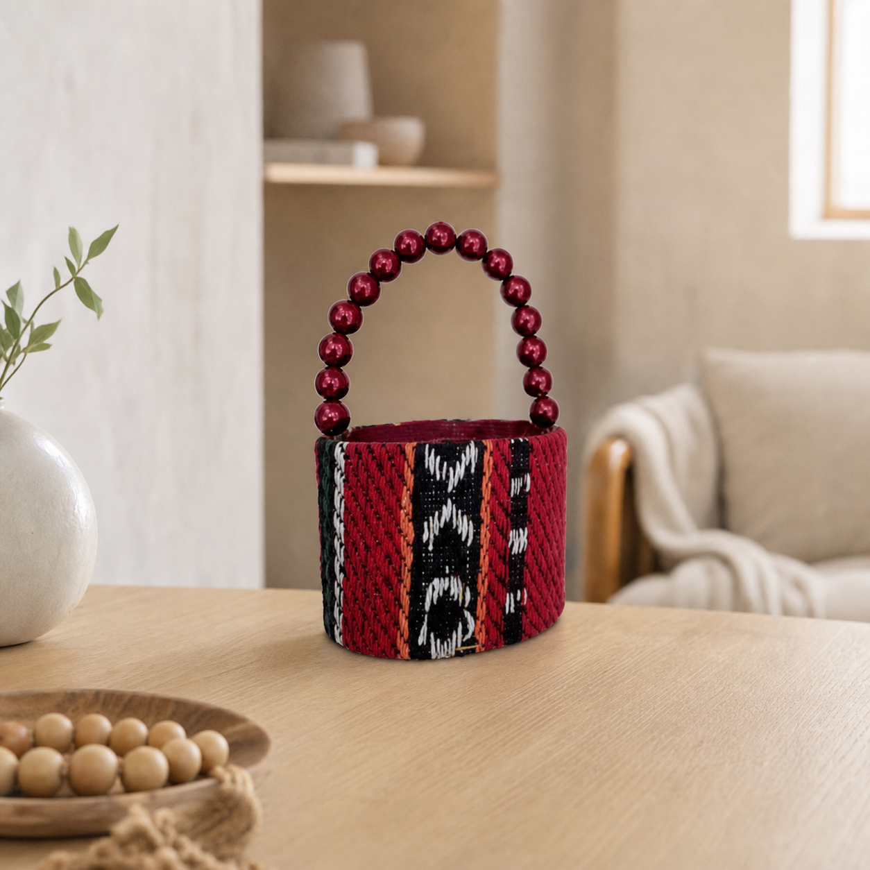 Woven embroidered favor basket with beaded handle in dark red, black and white
