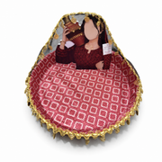 Red and gold fabric-covered wedding tray with gold braid trim and a printed standing figure