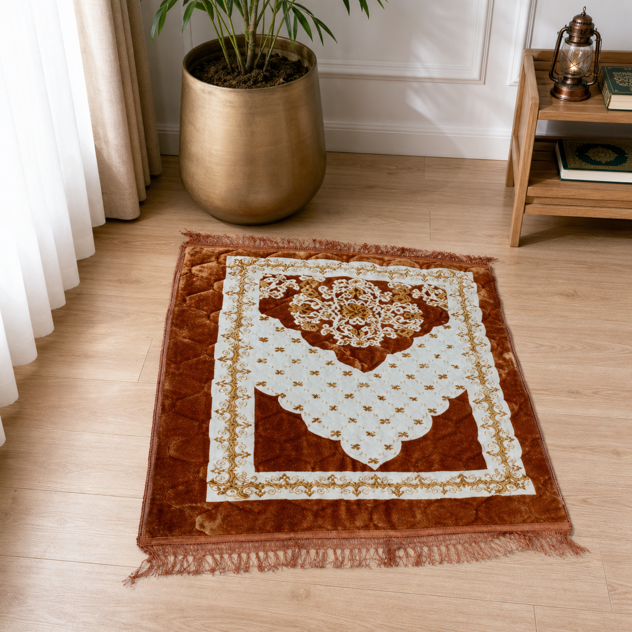 Padded prayer mat in rust orange and cream with a central floral medallion and fringe