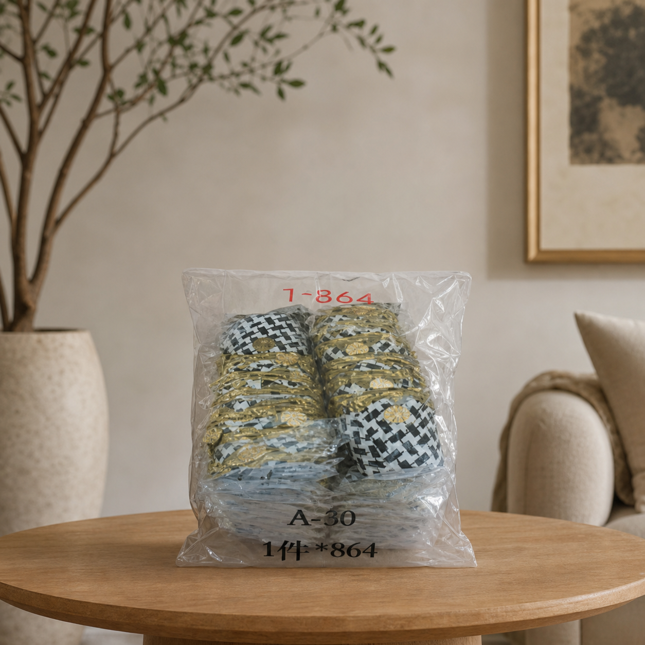 Clear bulk bag of houndstooth candy favors with gold trim, on a wooden table