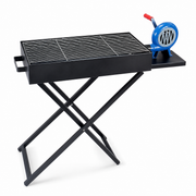 Black portable folding charcoal BBQ grill with blue air blower on X-frame