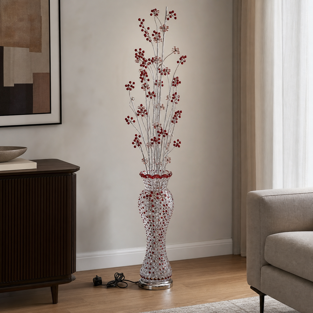 Beaded flower-vase floor lamp with red beaded branches in a living room beside a dark console