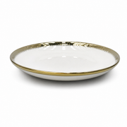 Deep white ceramic coupe plate with gold rim and fine brush-stroke edge, on a white background