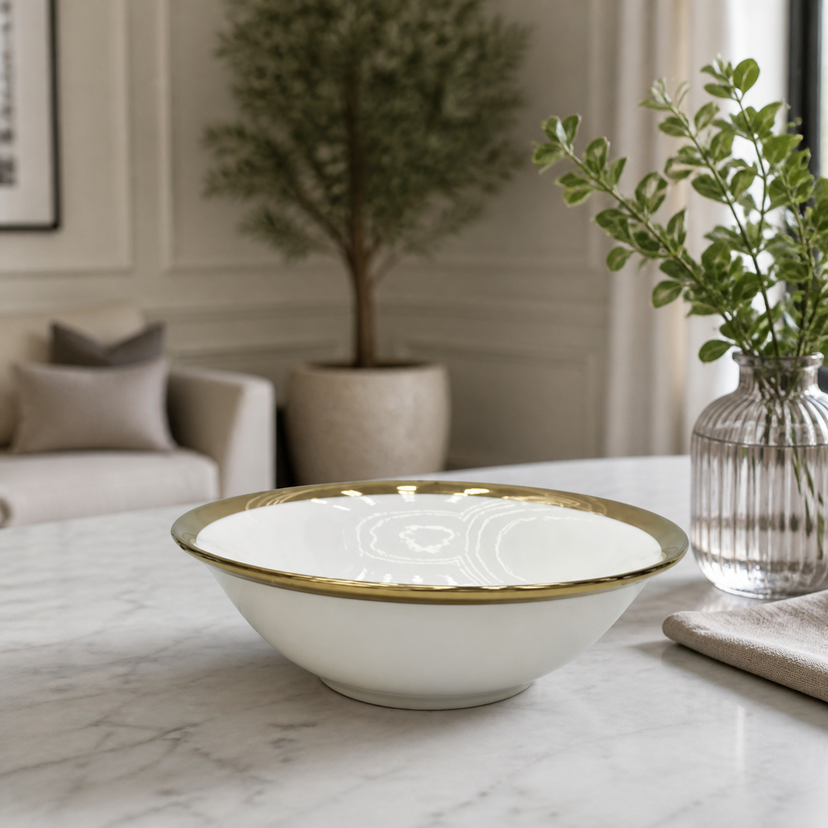 White ceramic bowl with gold rim, 7 inches