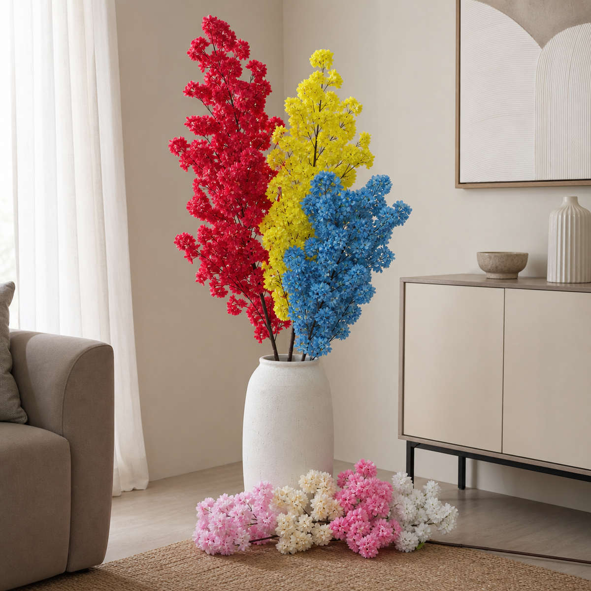 Artificial cherry blossom branch stems in red, yellow, pink and blue