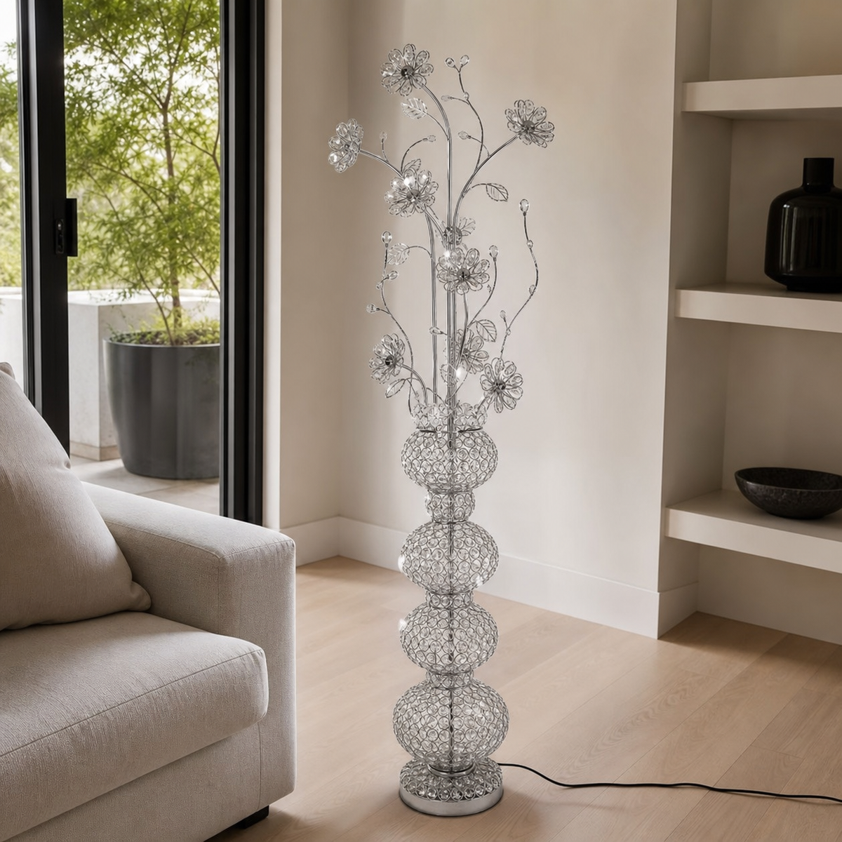 Chrome floral floor lamp with beaded wire-loop blooms and stacked bead spheres, in a living room
