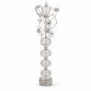 Chrome floral floor lamp with stacked bead spheres, topped by a lidded urn with a pointed finial