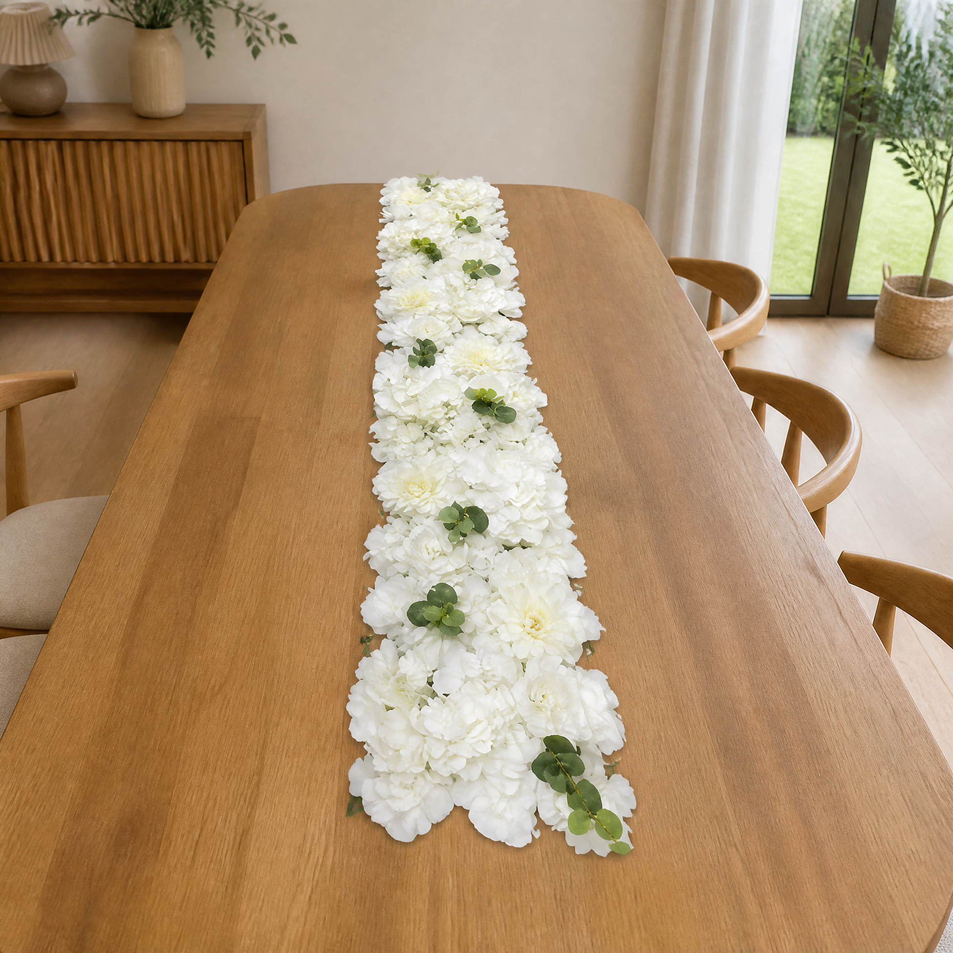 Row of white artificial flowers arranged as a 1.5 m table runner