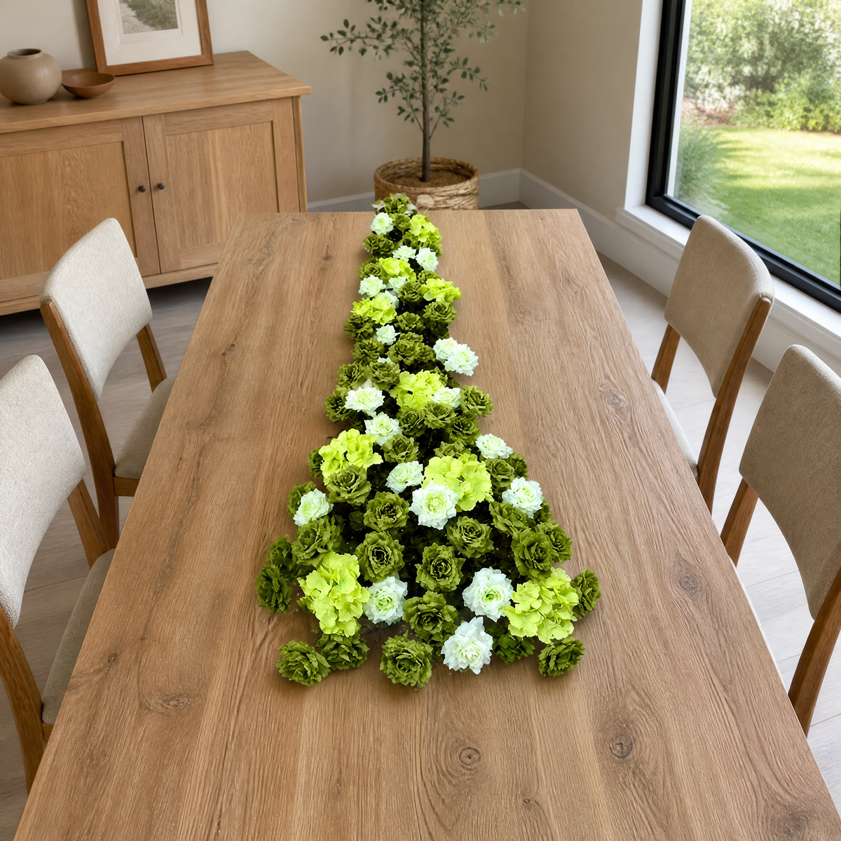 Row of artificial green and white roses arranged as a 2 m table runner
