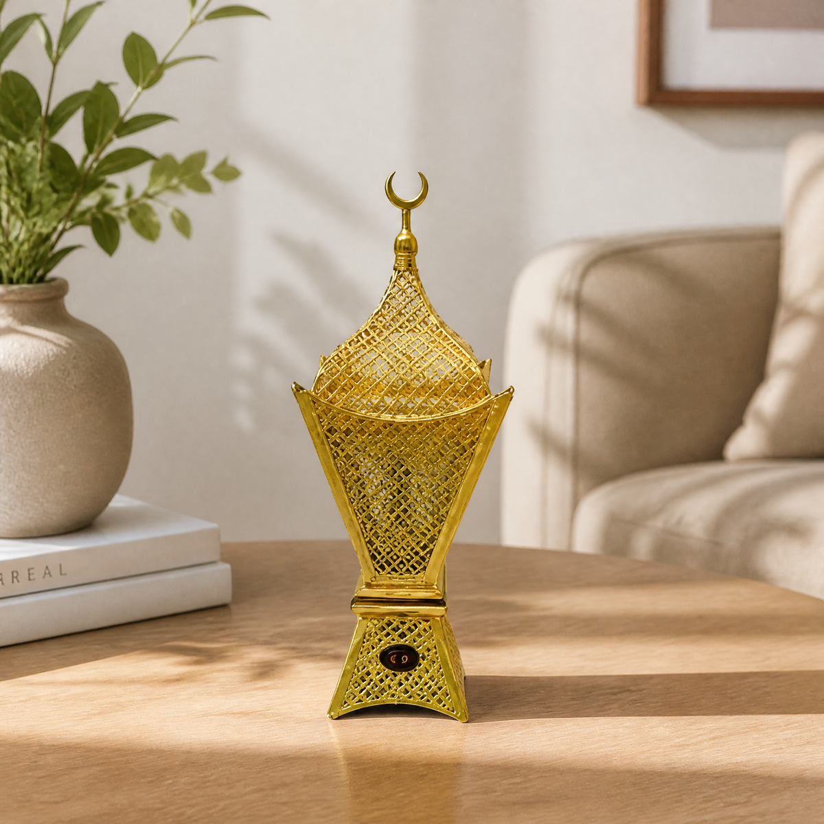 Gold electric incense burner with a crescent moon finial