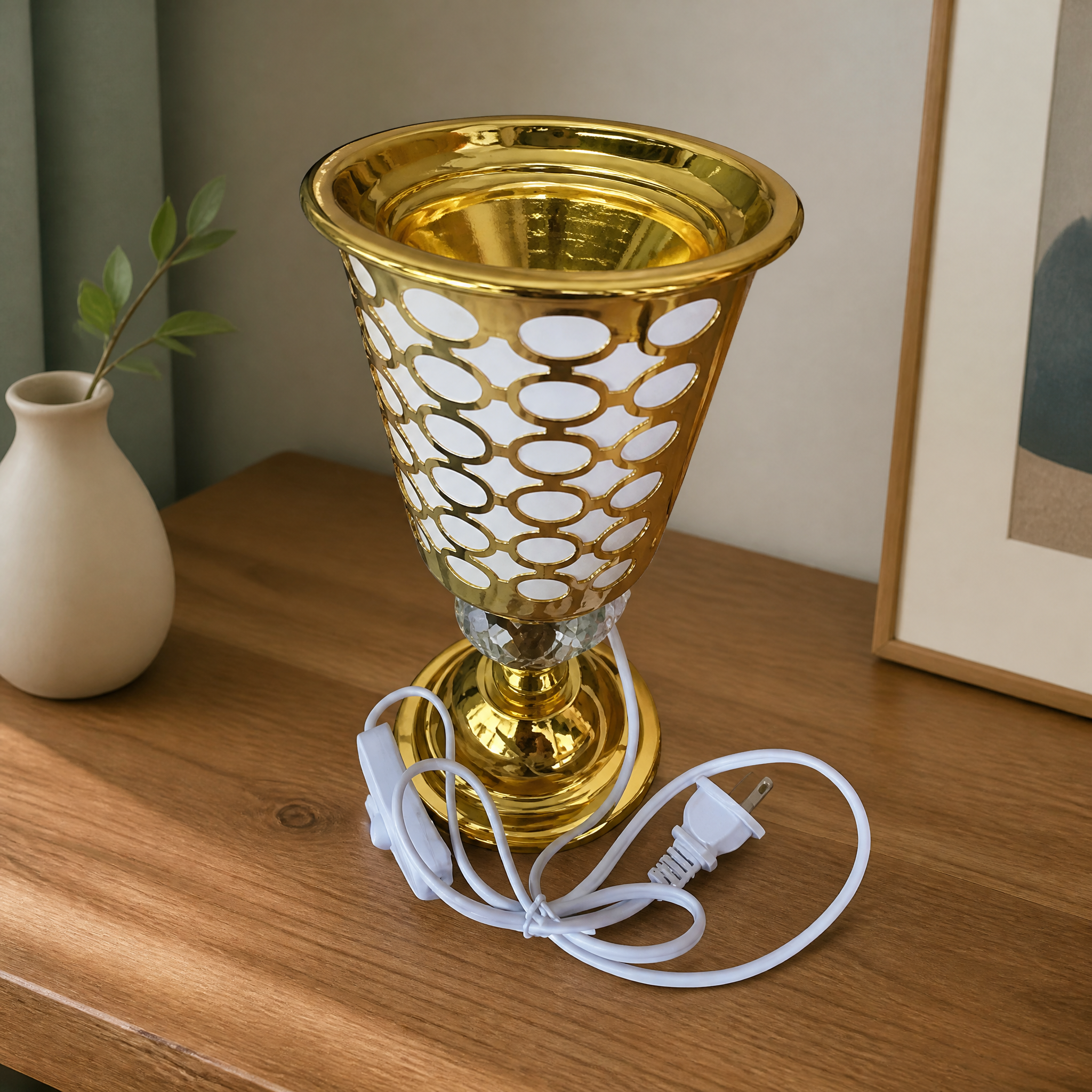 Gold cone-shaped electric burner lamp with white perforated detail and power cord