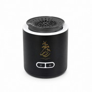 Small black cylindrical device with a perforated top