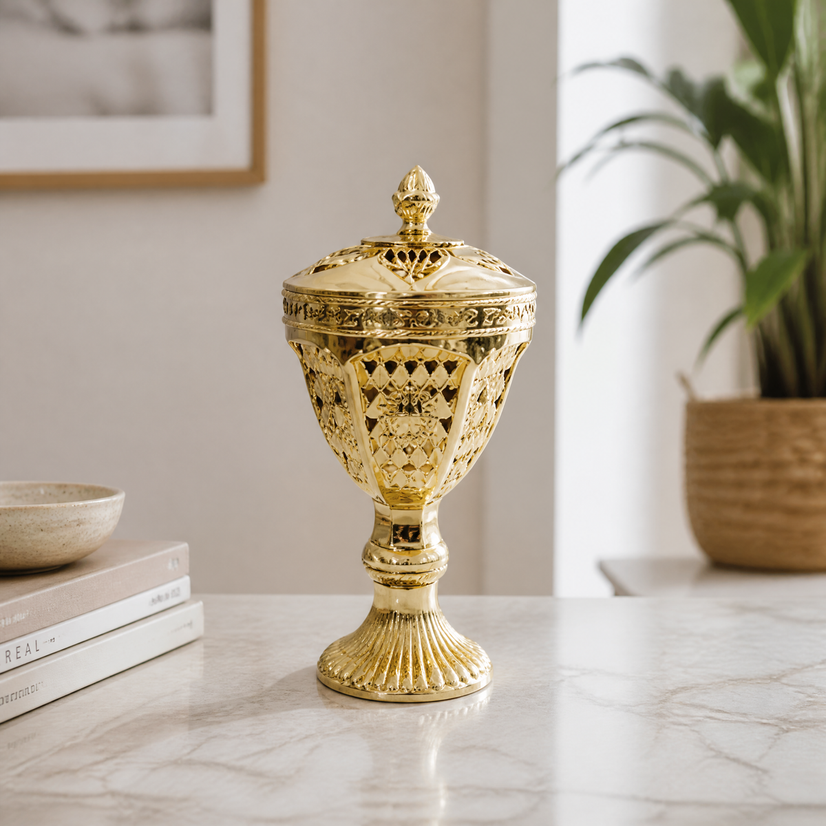 Gold lidded decorative burner on a pedestal base