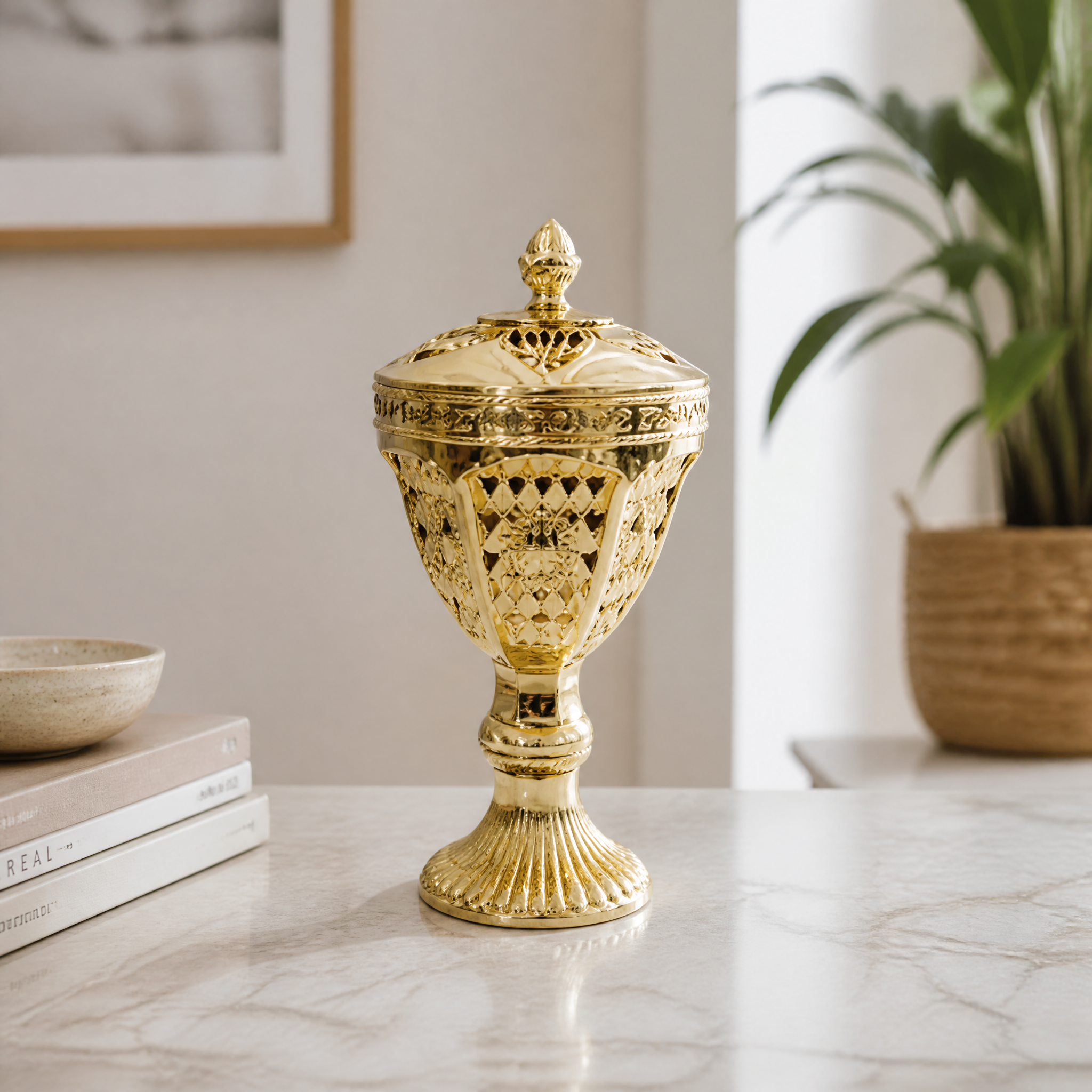 Gold lidded decorative burner on a pedestal base