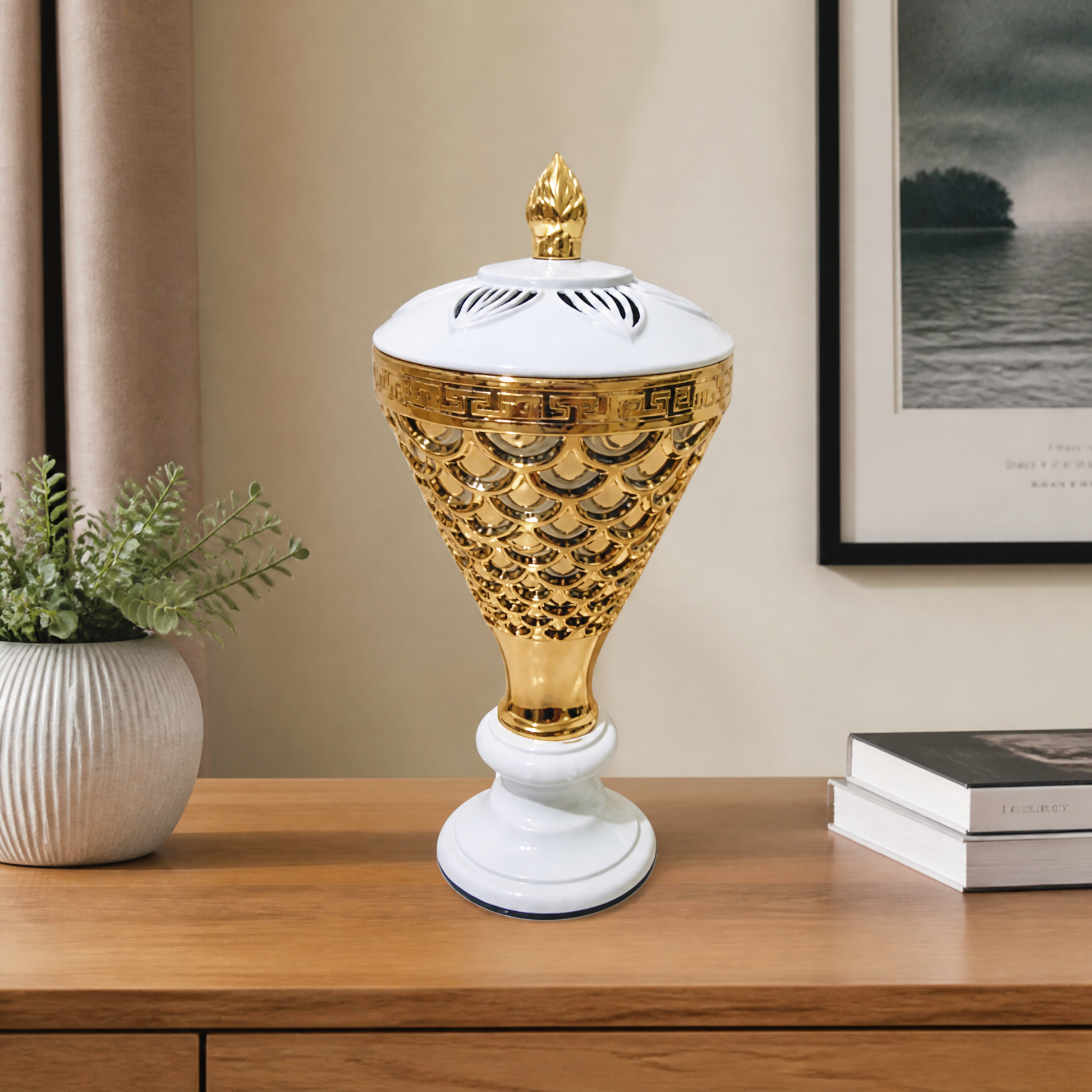 White and gold lidded decorative burner on a pedestal base with a pierced pattern