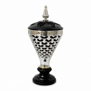 Black and silver lidded decorative burner on a pedestal base with a lattice pattern