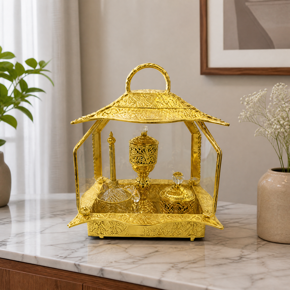 Gold pavilion-shaped burner display set with bottles on a tray base