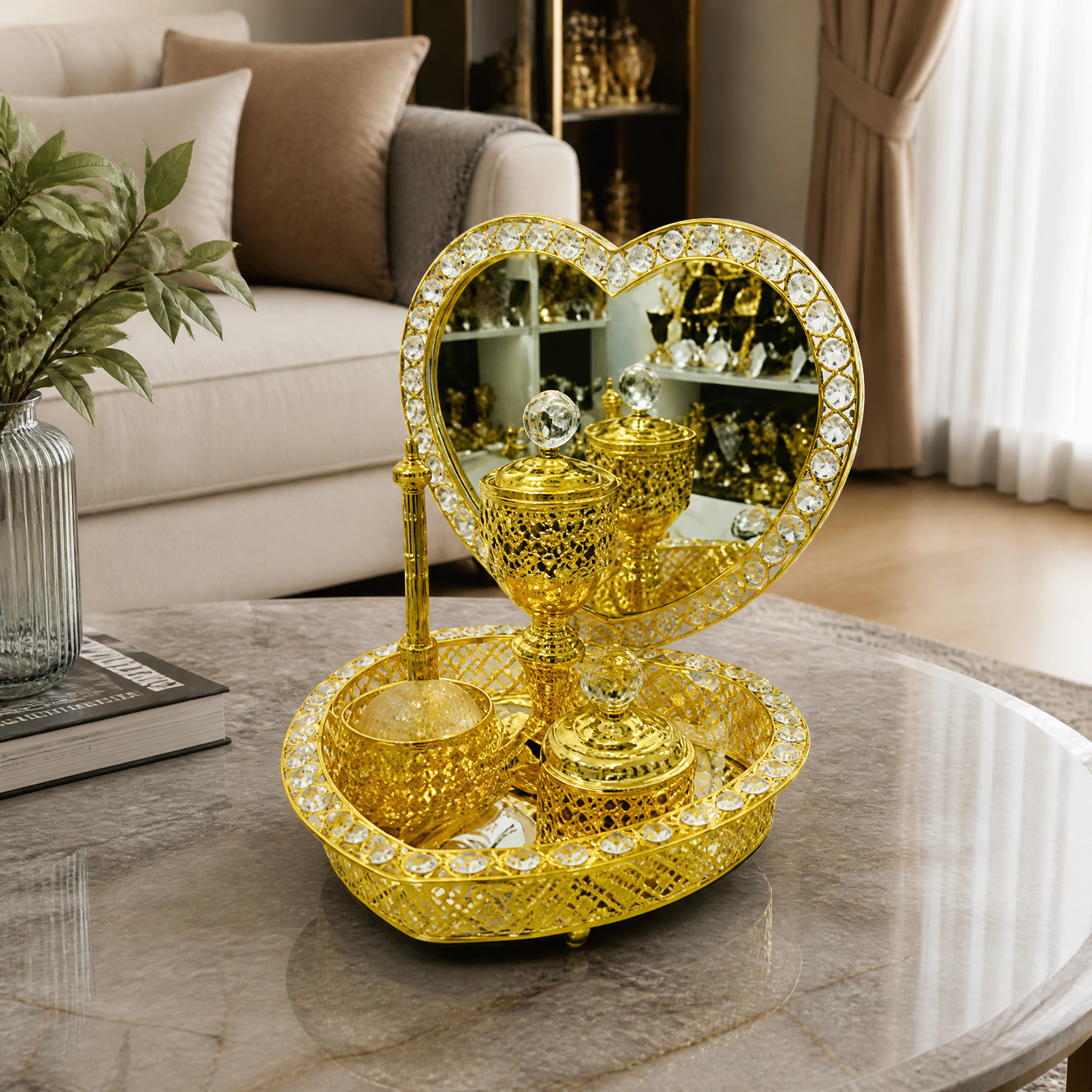 Gold heart mirror burner set displayed on a marble table in a living room