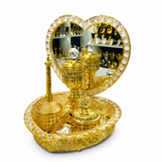 Gold heart-shaped mirror burner set with a lidded burner, dish and bowl on a crystal-set oval tray