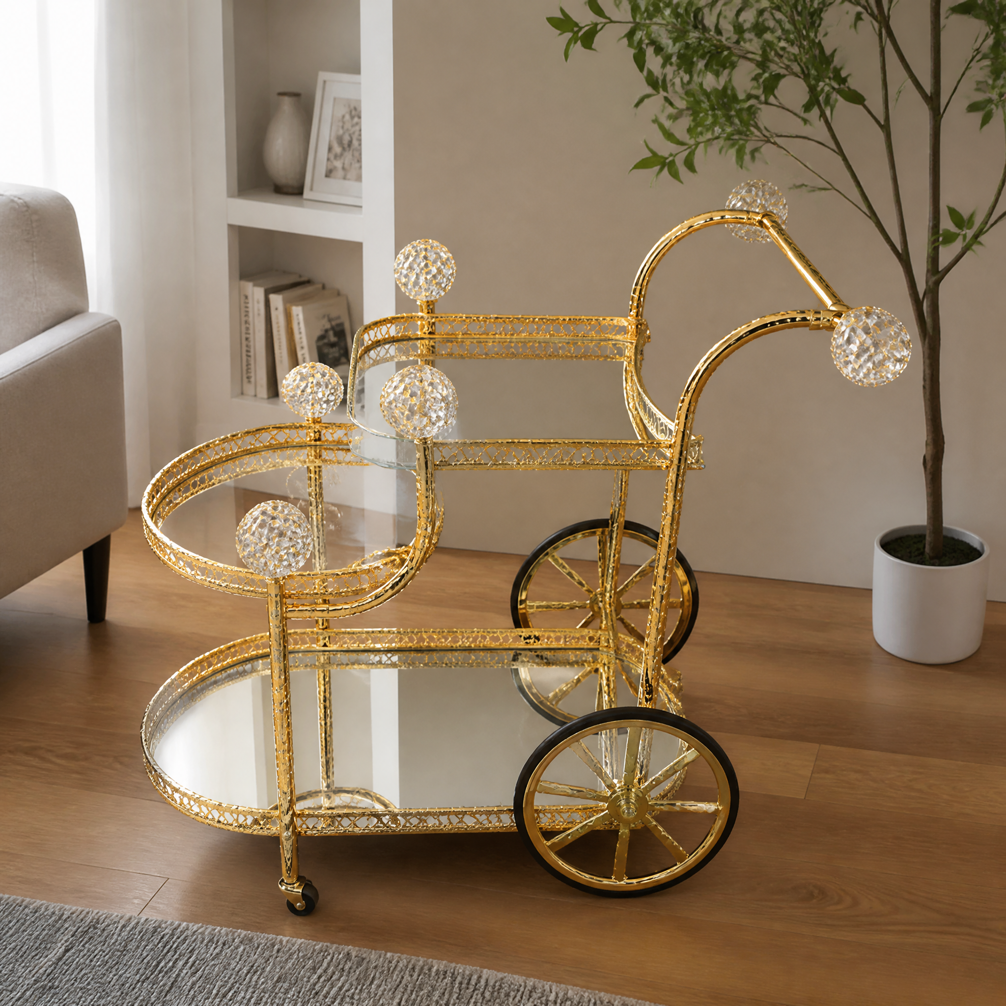 Gold three-tier mirrored serving cart on wheels in a living room with a sofa and potted tree