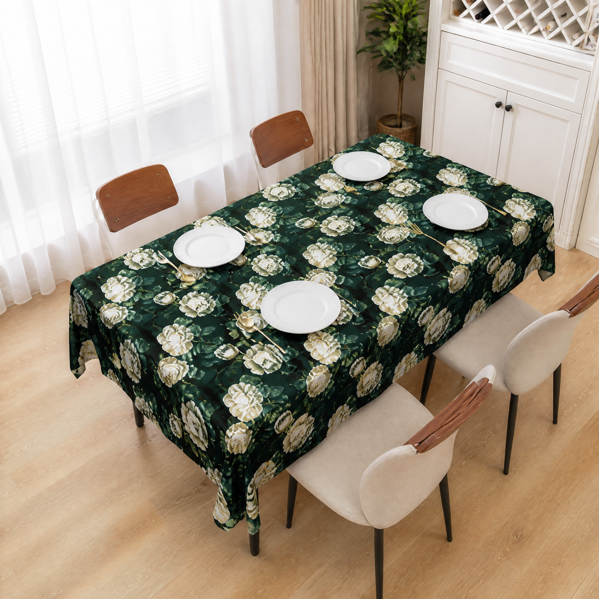 Dark green cream-rose print table cover on a dining table with four chairs in a bright room
