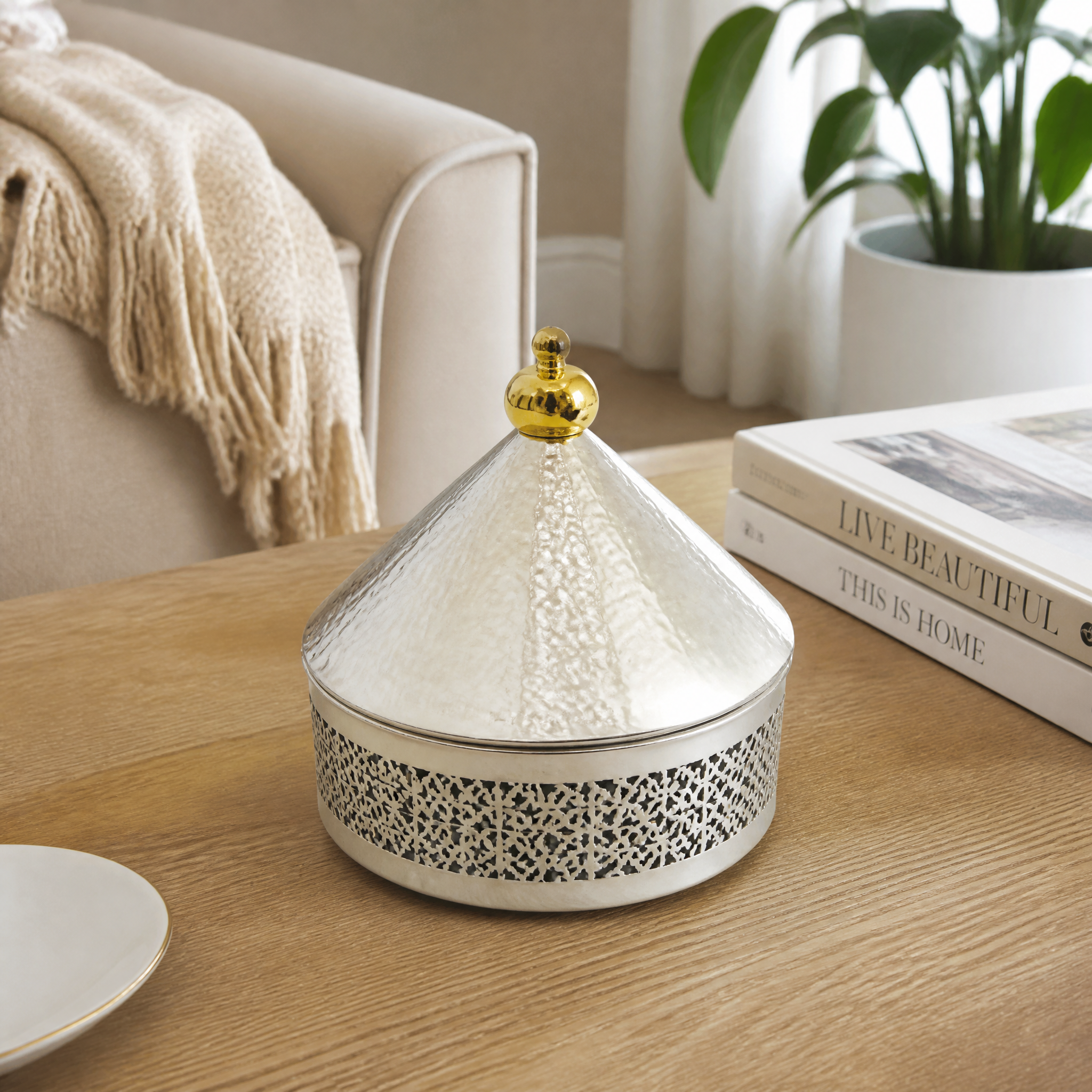 Domed candy box in silver with a gold-tone top and pierced lattice base