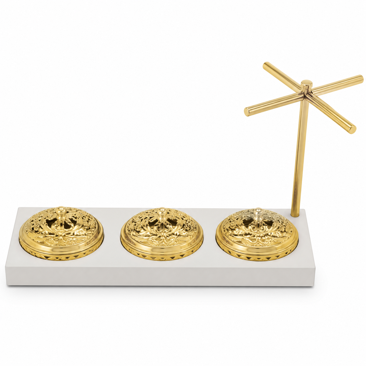 Three round gold dishes with pierced domed covers on a pale cream tray with a tall gold stand