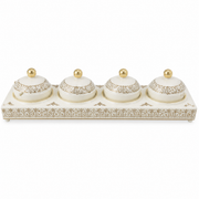 White and gold candy tray with four small lidded gold-topped jars