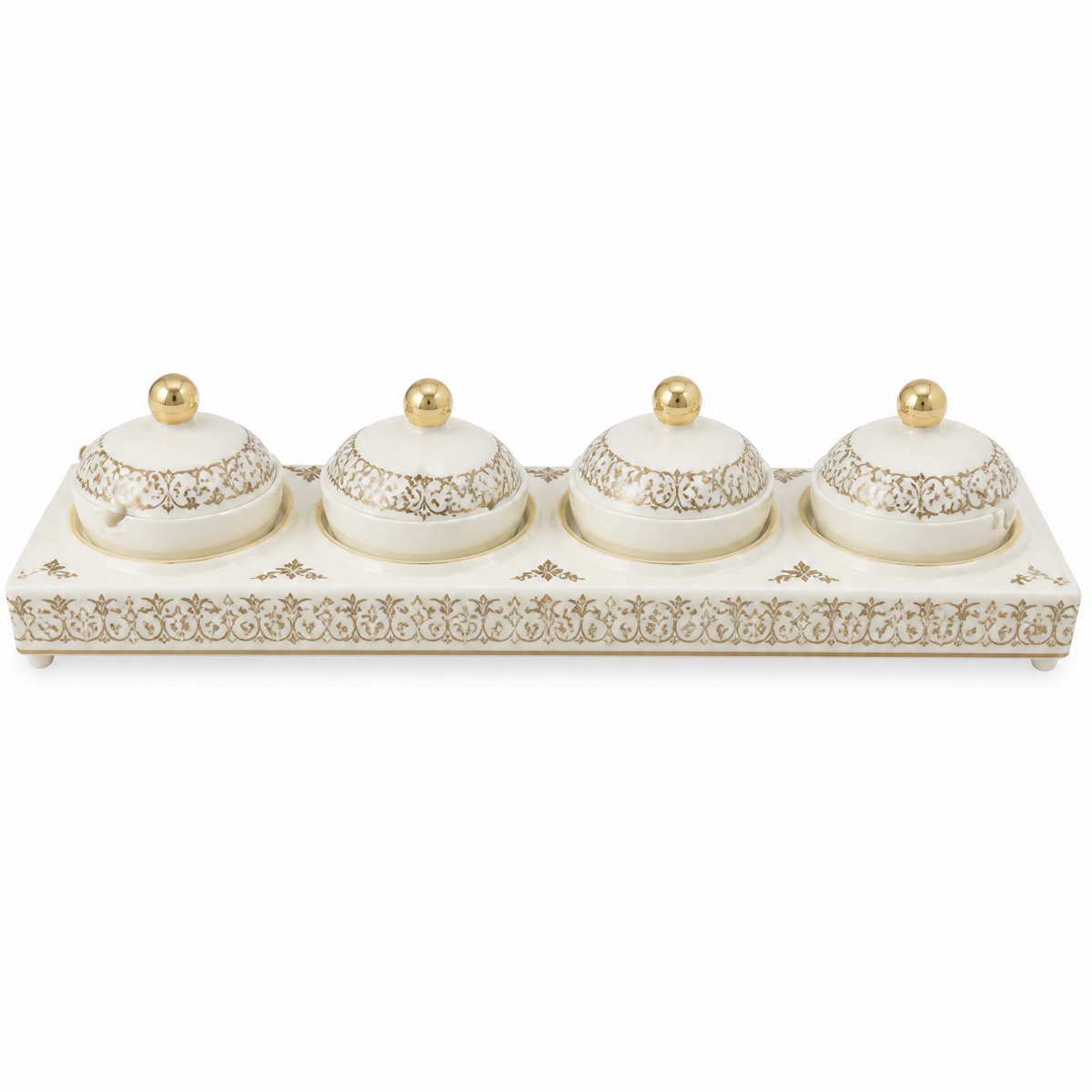 White and gold candy tray with four small lidded gold-topped jars