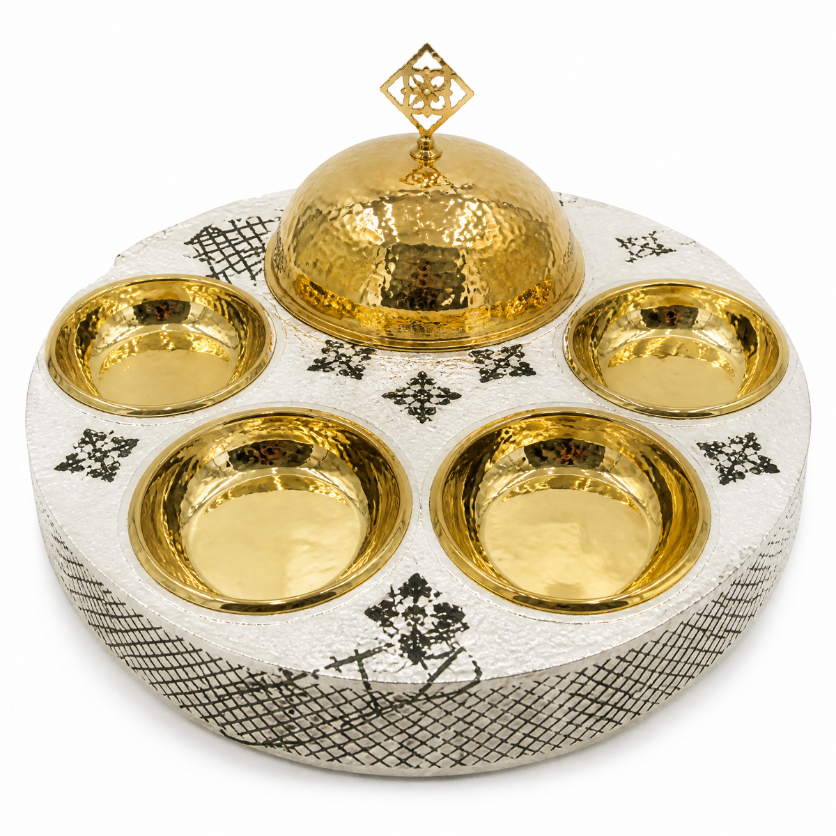 Round white tray with dark patterned rim, hammered gold-tone dome and four hammered gold-tone bowls