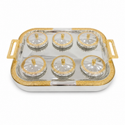 Rectangular silver tray with gold handles holding six clear glass bowls with gold-rimmed domed lids