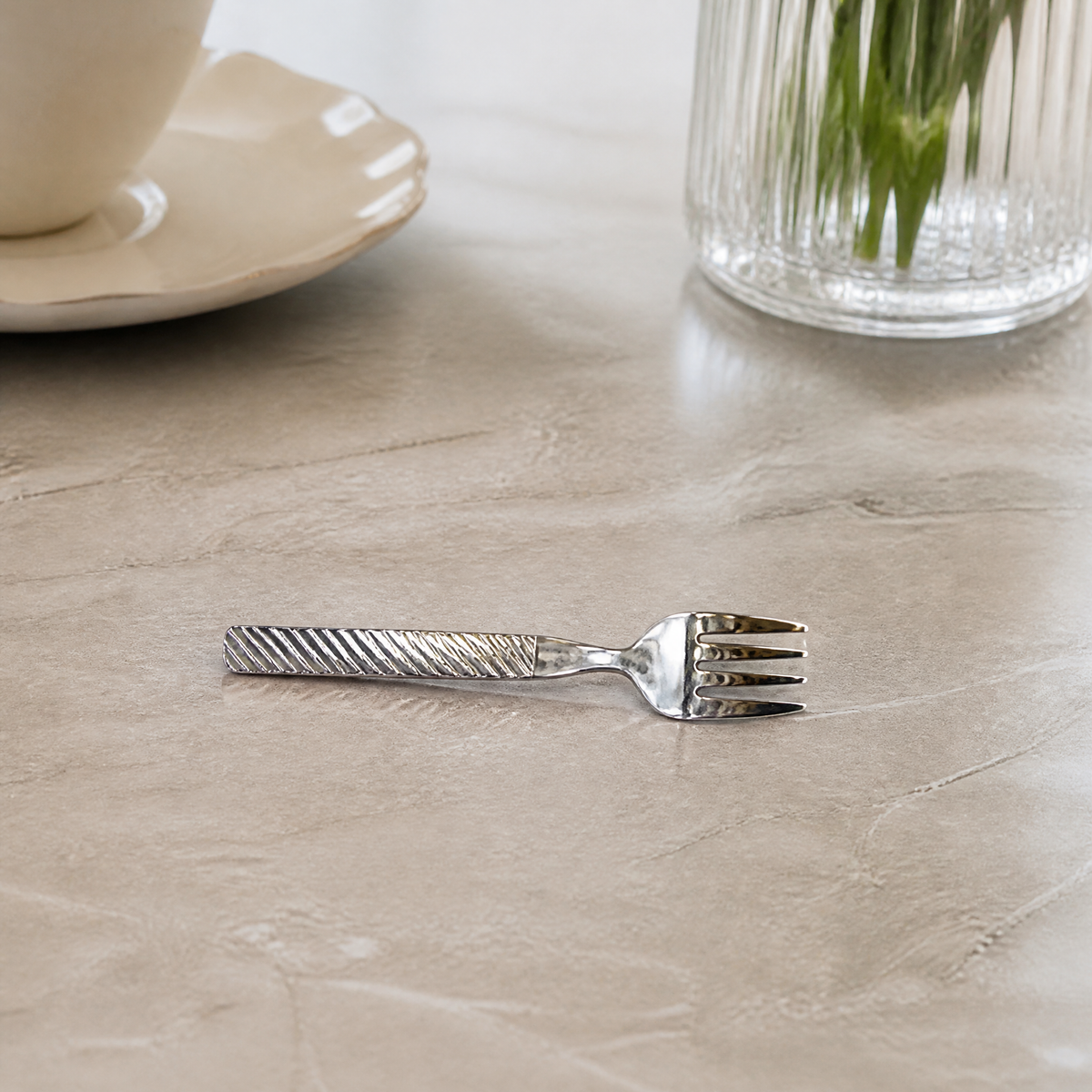 One of six silver tea forks with twisted handles 15.5 cm