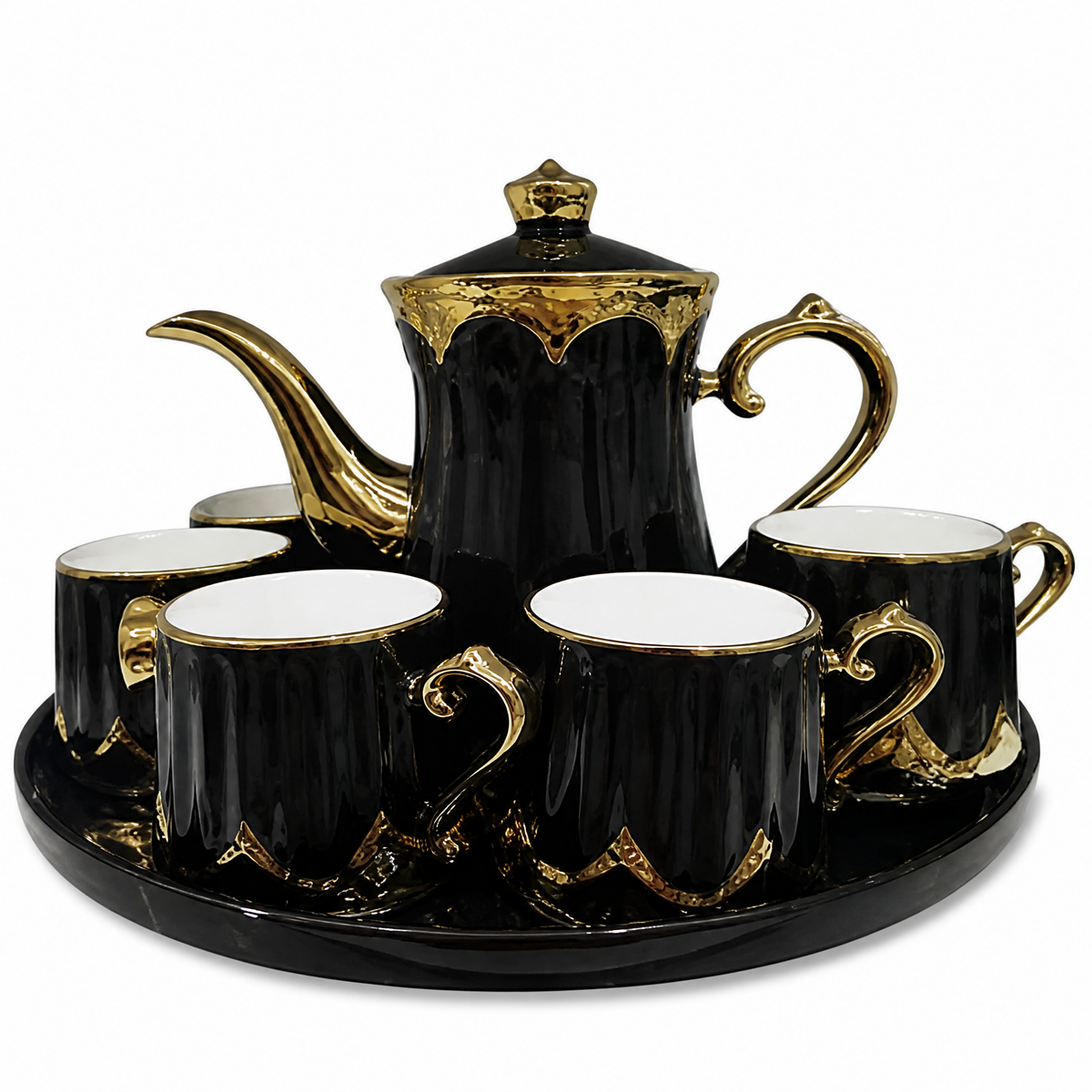 Black and gold tea service with a lidded teapot cups and an oval tray