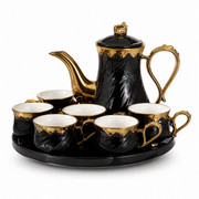 Black and gold tea service with a lidded teapot six cups and a round tray