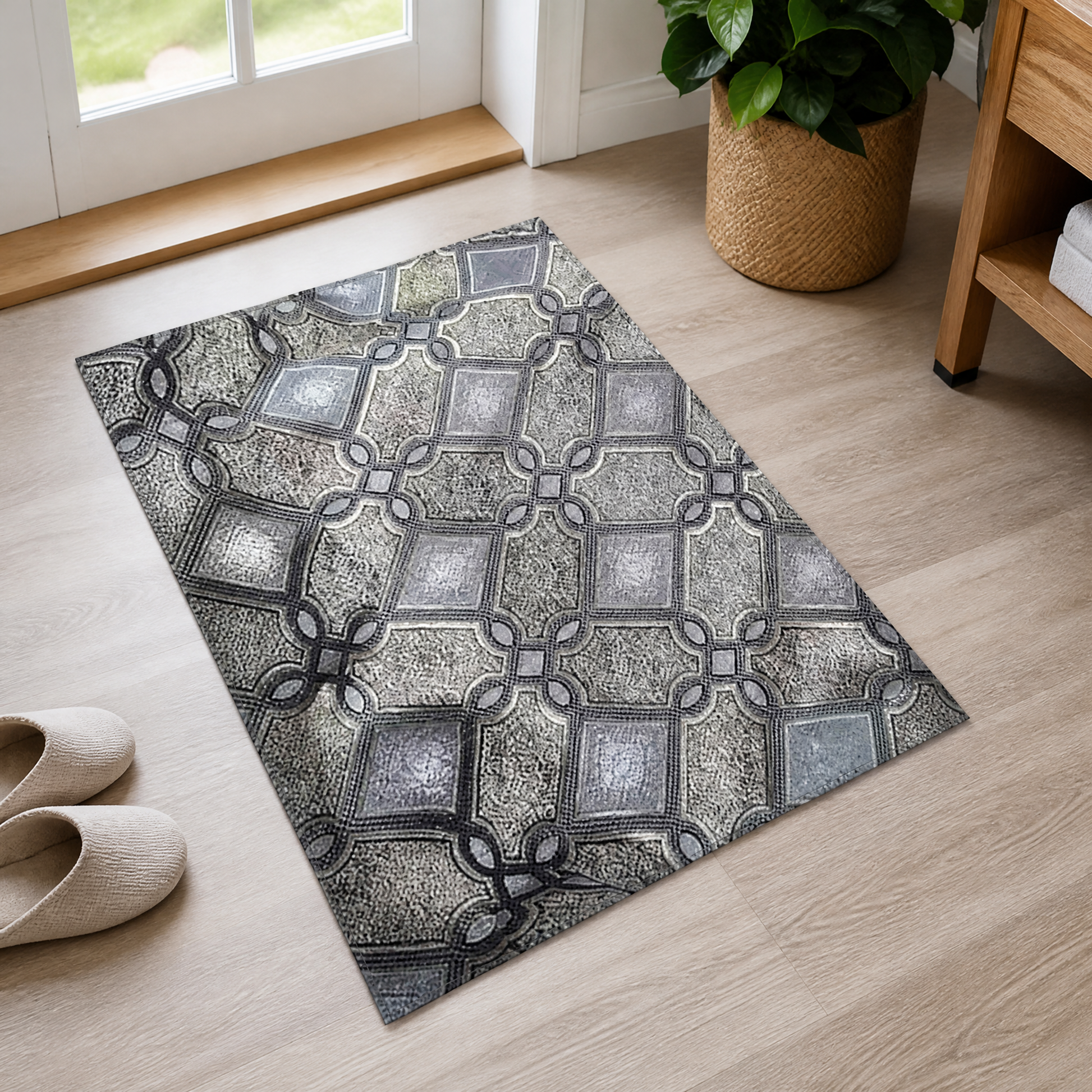 Grey and silver lattice-print fabric panel laid flat on a wood floor beside a doorway
